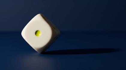 A single die balanced upright on one corner on navy stone, one pip picked out in acid yellow-green, casting a long hard shadow
