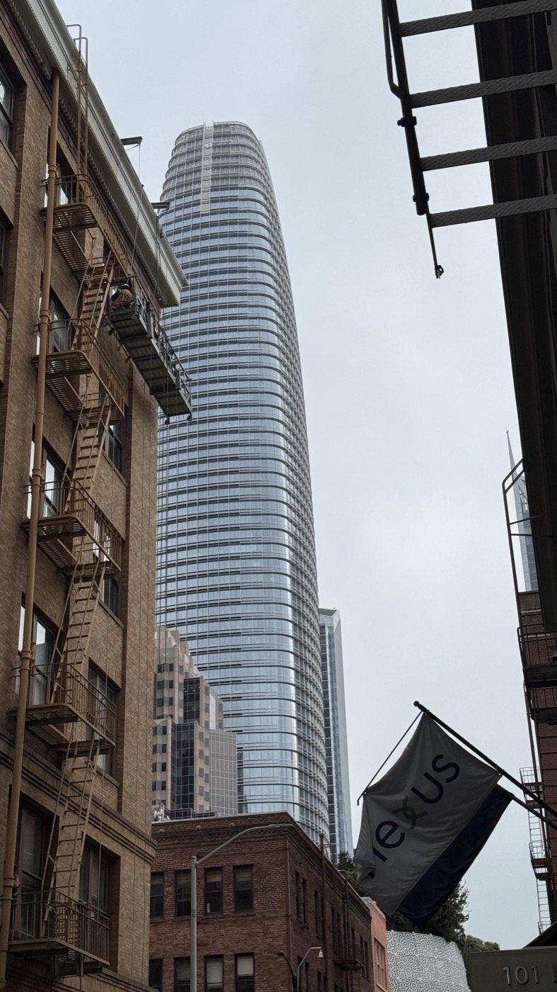 Salesforce Tower from a downtown street, the tallest of the signs the city rents to technology companies.